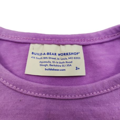 Eredeti fehér Build-A-Bear Workshop gyártói textil címke közelről