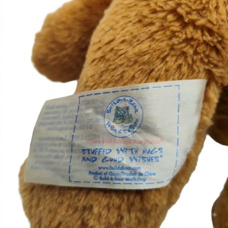 Build-A-Bear barna plüss kutya címkéje