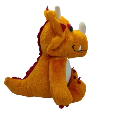 Kinder narancssárga dinoszaurusz plüss figura oldalnézetből