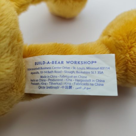 Eredeti fehér Build-A-Bear Workshop gyártói textil címke közelről