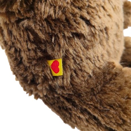 Szőtt sárga oldalcímke piros szívvel a Build-A-Bear plüssön