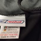 Eredeti Reebok 100% poliészter gyári bevarrt textil címke a nadrág belsejében